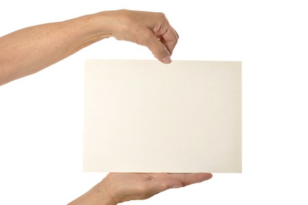 Hands holding blank paper on a white backgroundの写真素材