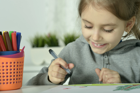 Portrait of Little girl drawing at homeの写真素材