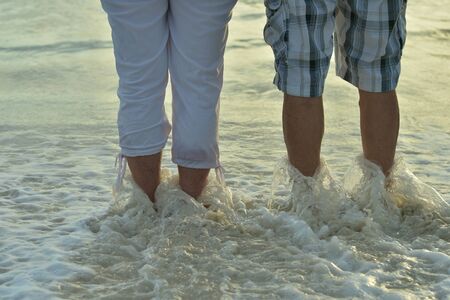 Happy elderly couple rest at tropical beach