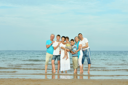 Portrait of a happy family at beach in summerの写真素材