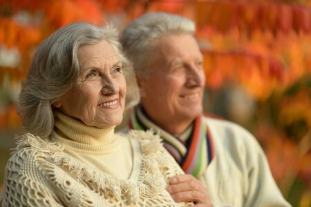Portrait of a mature couple in the autumn park