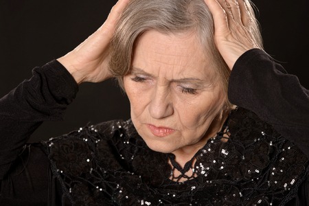 Portrait of a thoughtful sad elderly womanの写真素材