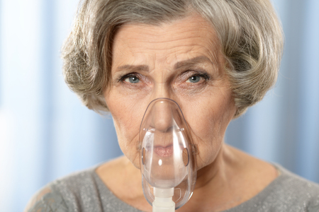 portrait of a senior woman with inhalerの写真素材