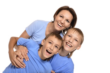 Cute mom with sons isolated on whiteの写真素材