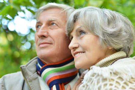 Portrait of a happy senior couple standing in park