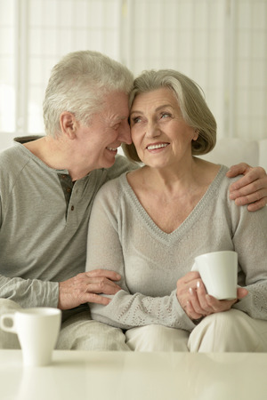 happy Senior couple portrait resting at homeの写真素材
