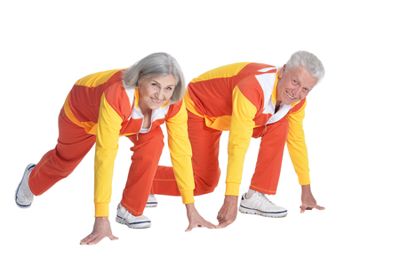Portrait of Senior Couple Exercising On White Backgroundの写真素材