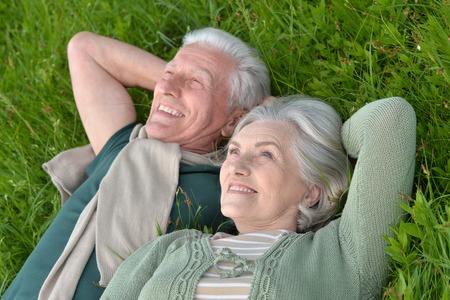 Loving mature couple in a summer parkの写真素材