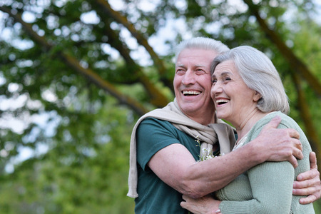 Nice mature couple in a spring parkの写真素材