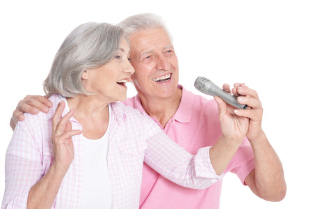 Portrait of a senior couple and microphoneの写真素材