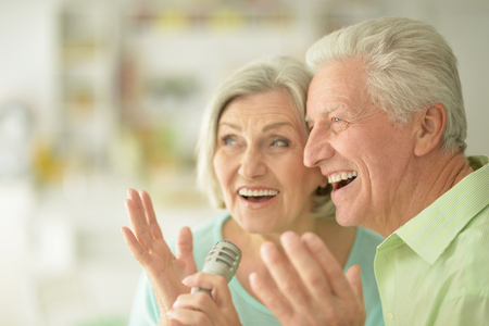 Portrait of a Senior couple and microphoneの写真素材