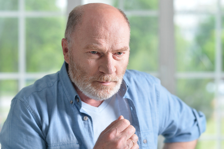 Portrait of a senior man at homeの写真素材