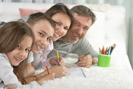 Portrait of happy family painting at homeの写真素材