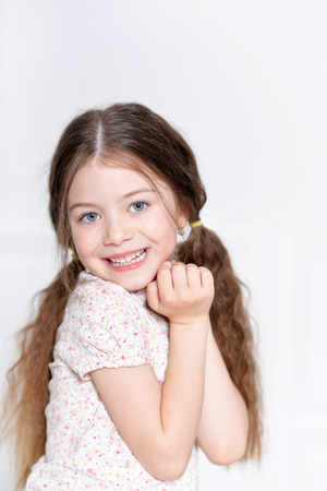 portrait of cute little girl posing in beautiful dressの写真素材