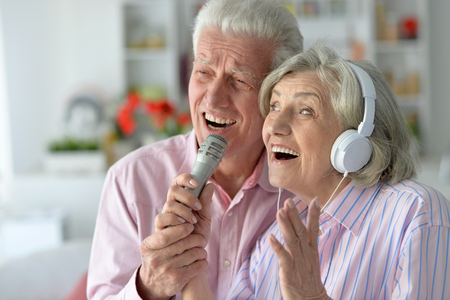 Portrait of a senior couple and microphoneの写真素材