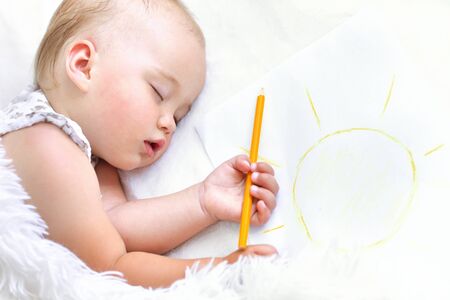 Portrait of a cute sleeping baby girl in bedの写真素材