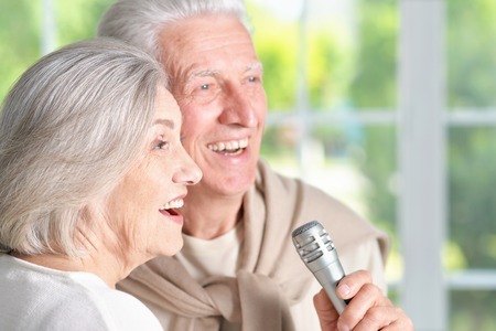 Portrait of a senior couple and microphoneの写真素材