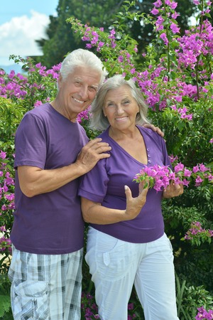 Portrait of beautiful senior couple outdoor in summer park