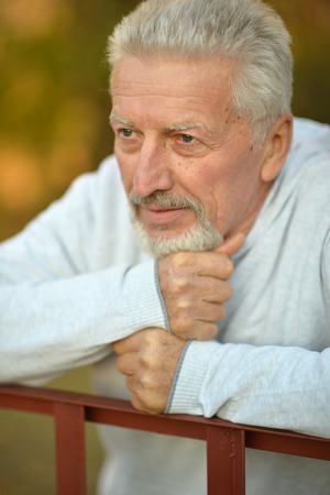 Portrait of a senior man thinking about something outdoorの写真素材