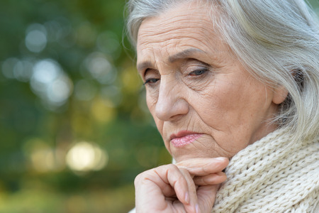 Portrait of a sad elderly woman close-upの写真素材