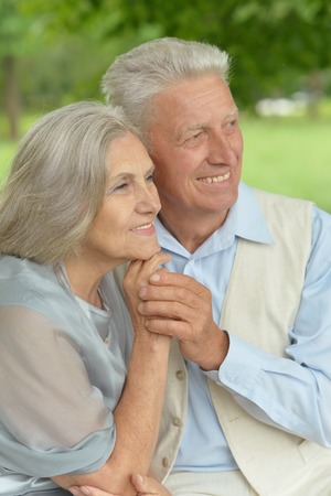 Loving mature couple in a summer park