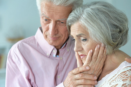 close up portrait of a senior couple at homeの写真素材