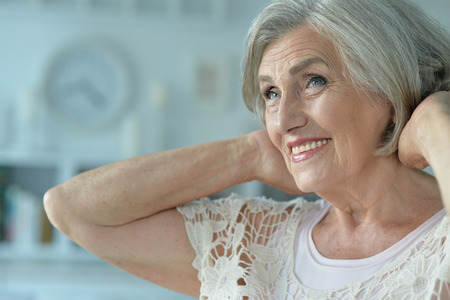 portrait of smiling senior woman at home