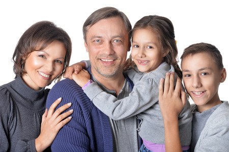Portrait of happy family of four isolated on white background