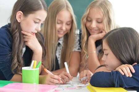 children at school sit in the classroomの写真素材
