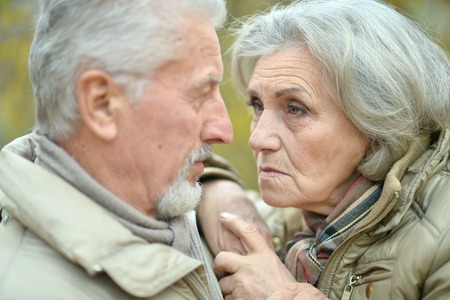 Sad senior couple in  parkの写真素材