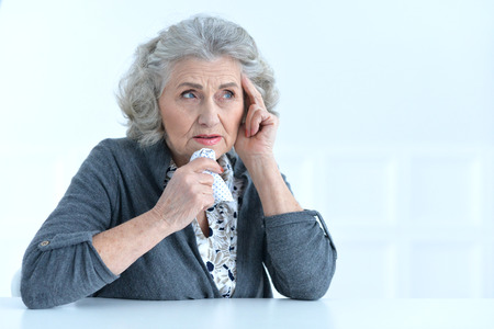 senior woman having a headacheの写真素材