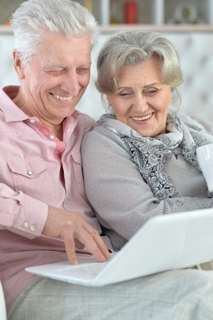 mature couple using laptopの写真素材