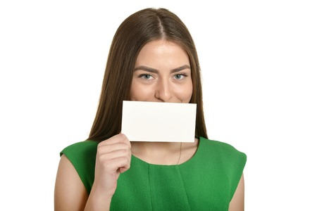 Beautiful woman in green dress with white bannerの写真素材