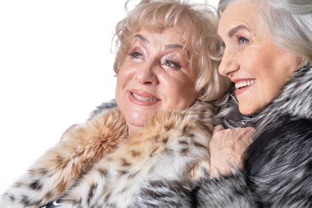 Two senior women isolate on whiteの写真素材