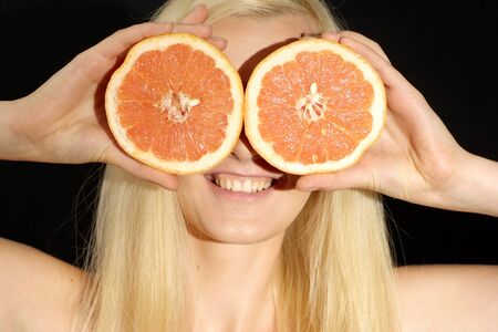Fun blonde on black backgroundの写真素材
