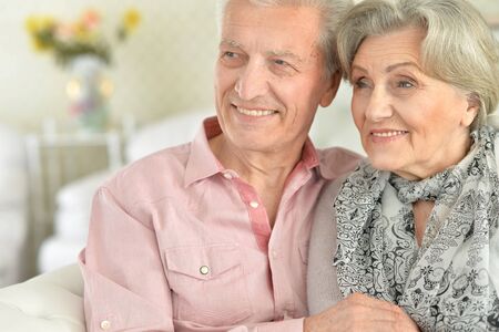 Happy elderly couple embracing