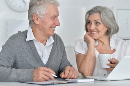 Elderly couple with a laptopの写真素材