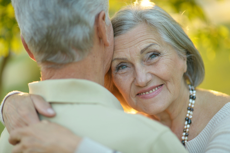 Happy elderly couple embracingの写真素材
