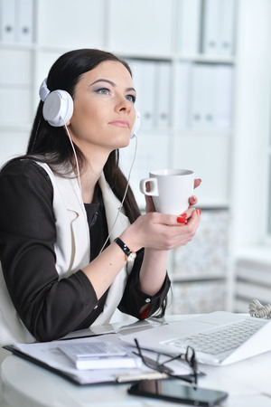 Business woman sitting at tableの写真素材