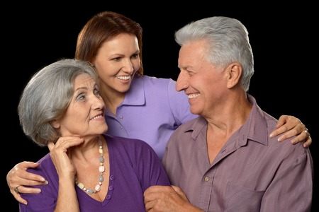 Elderly parents and their adult daughterの写真素材