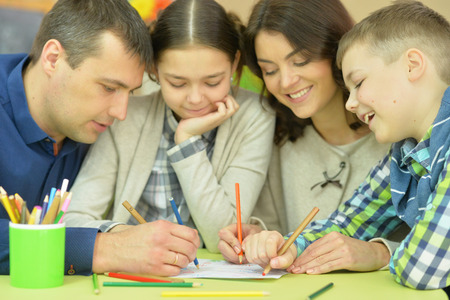 Children draw with their parents