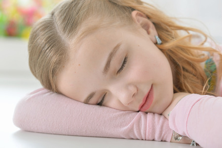 Cute little girl sleepingの写真素材