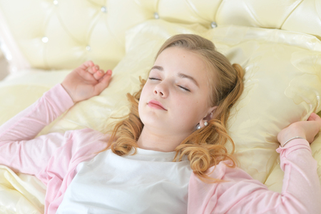 Cute little girl sleepingの写真素材