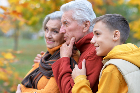 Grandparents and grandson outdoorsの写真素材
