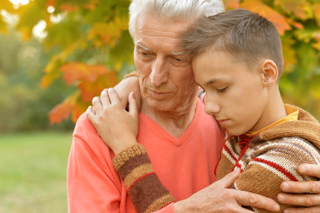 sad grandfather and grandsonの写真素材