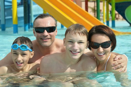 Family relaxing in the pool