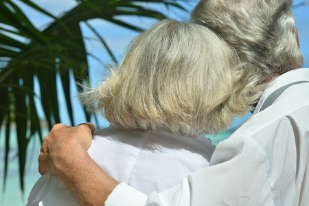 senior couple hugging outdoor