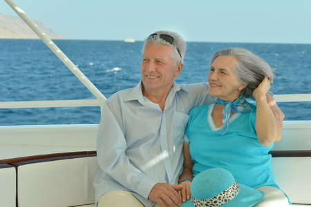 Elderly couple resting on yachtの写真素材
