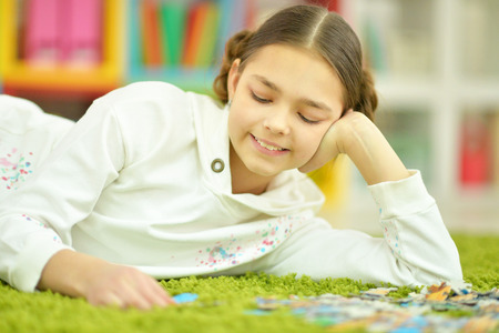 girl collecting puzzlesの写真素材