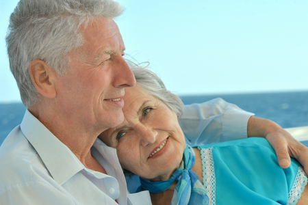 Senior couple relaxing at poolの写真素材